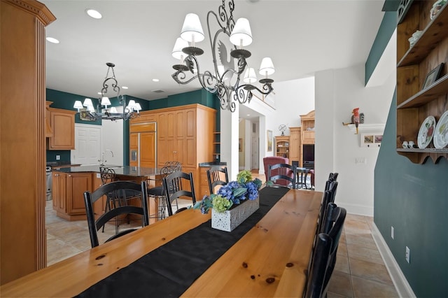 dining area featuring light tile patterned floors, a notable chandelier, recessed lighting, and baseboards