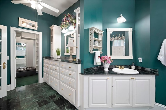 bathroom featuring marble finish floor, ceiling fan, and vanity