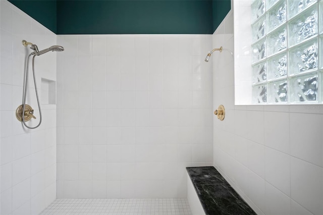 bathroom with tiled shower