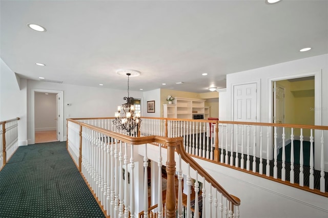 corridor with carpet, a notable chandelier, recessed lighting, and baseboards