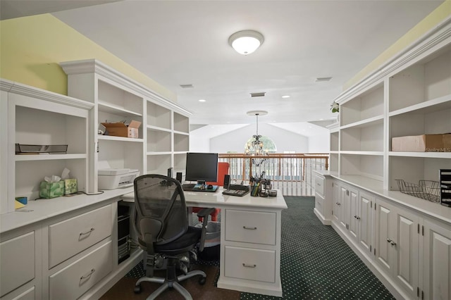 office space featuring dark colored carpet, visible vents, an inviting chandelier, and vaulted ceiling