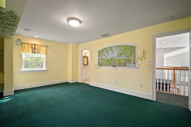 empty room with dark colored carpet, visible vents, baseboards, and recessed lighting