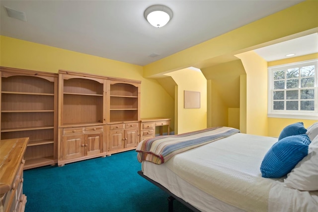 bedroom with dark colored carpet