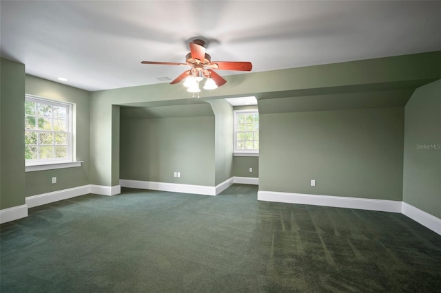 spare room with visible vents, a ceiling fan, recessed lighting, dark colored carpet, and baseboards