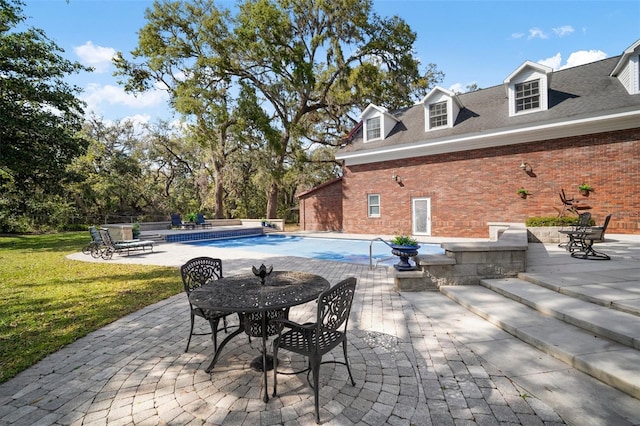 view of patio / terrace with an outdoor pool