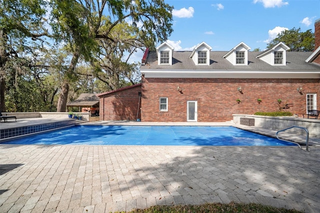 pool with a patio