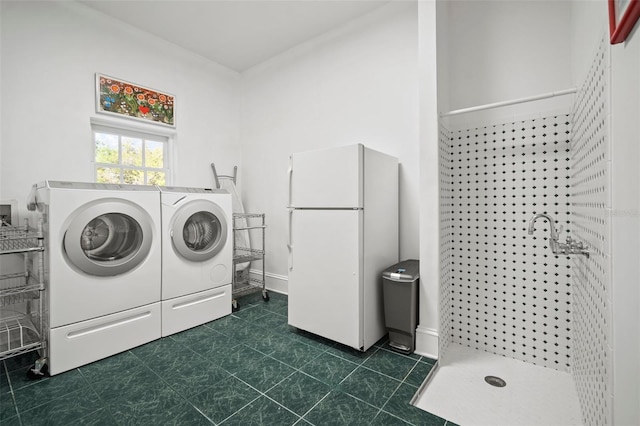 laundry area with washing machine and clothes dryer and laundry area