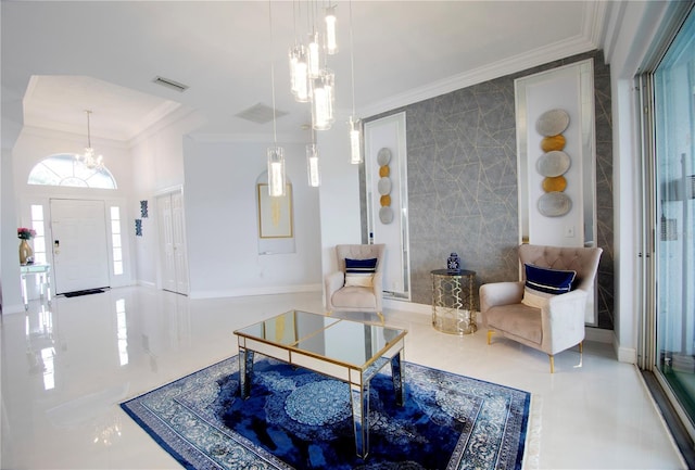 living area with visible vents, baseboards, ornamental molding, a notable chandelier, and marble finish floor