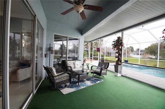 sunroom featuring a ceiling fan