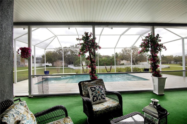 view of swimming pool with glass enclosure, a lawn, and a fenced in pool