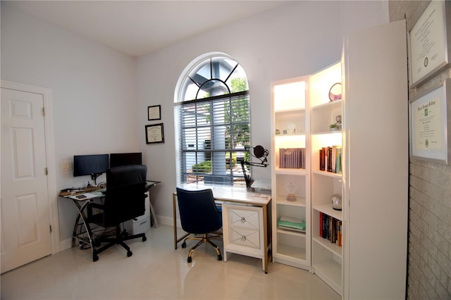 office area featuring light tile patterned flooring and baseboards