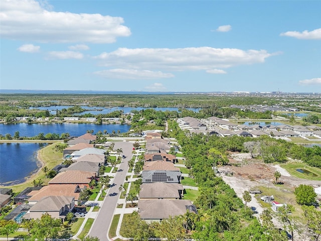aerial view featuring a residential view and a water view
