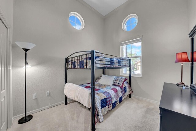 carpeted bedroom with baseboards