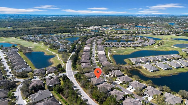 drone / aerial view with a residential view and a water view