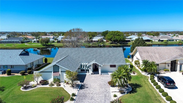 bird's eye view featuring a residential view and a water view