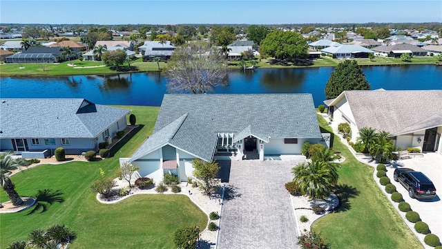 aerial view with a residential view and a water view