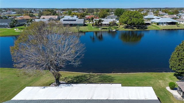 bird's eye view featuring a residential view and a water view