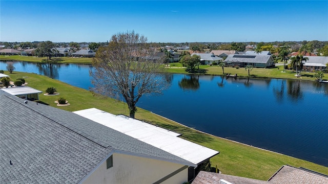 aerial view featuring a residential view and a water view