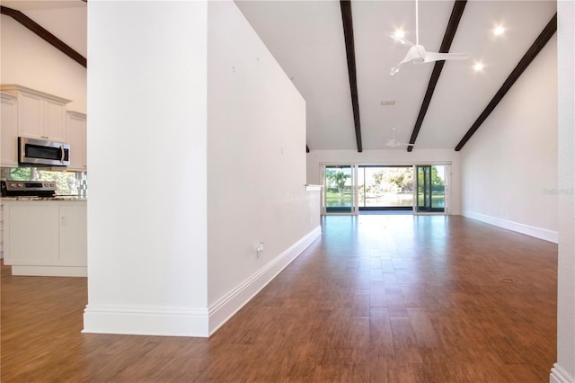 unfurnished room with beamed ceiling, baseboards, light wood-type flooring, and high vaulted ceiling