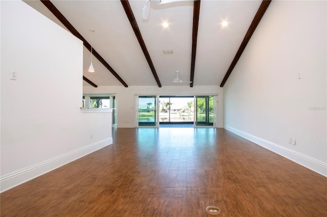 unfurnished living room featuring beam ceiling, wood finished floors, baseboards, and ceiling fan