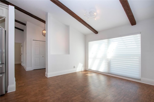 unfurnished living room with dark wood finished floors, vaulted ceiling with beams, and baseboards