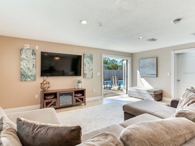 living area featuring recessed lighting, light tile patterned flooring, baseboards, and visible vents