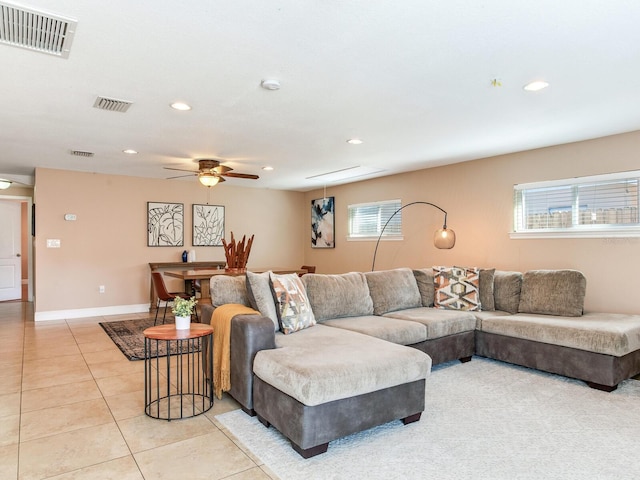 living room featuring light tile patterned floors, visible vents, recessed lighting, and baseboards