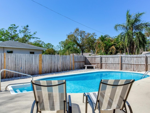 view of pool featuring a fenced in pool, a patio, and a fenced backyard