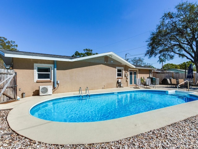 view of pool with ac unit, a fenced in pool, a patio, and fence