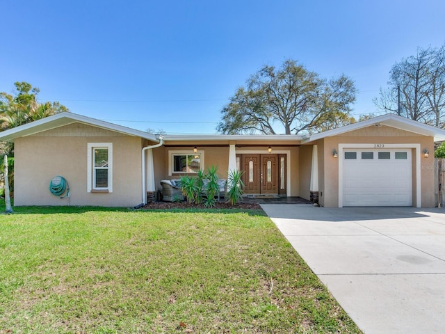 single story home with a front yard, an attached garage, driveway, and stucco siding