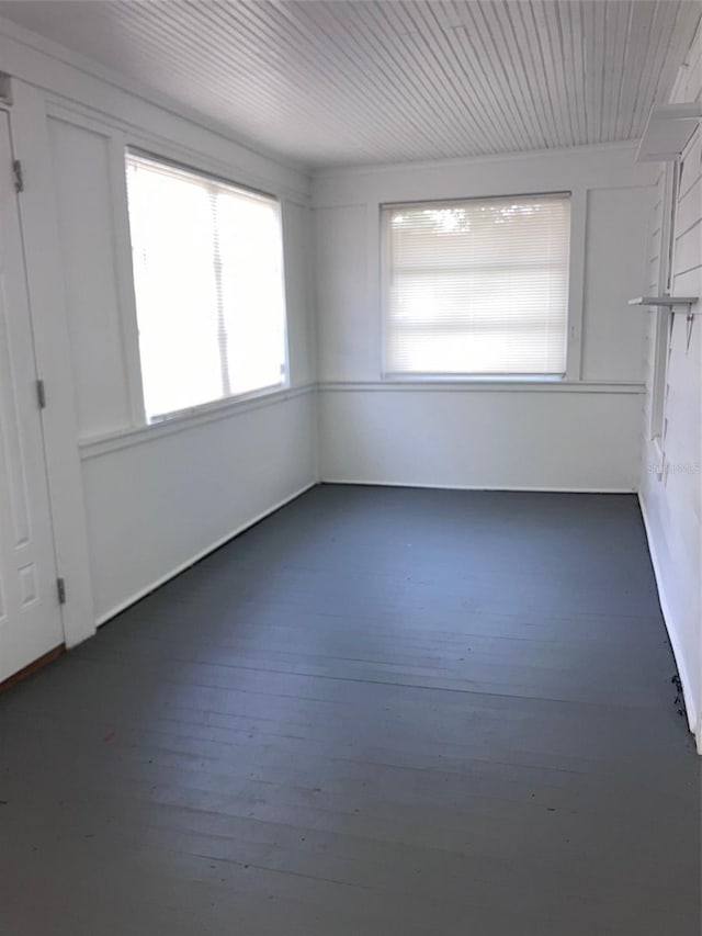 unfurnished room featuring wood-type flooring