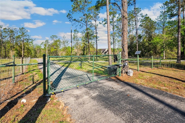 view of gate with fence