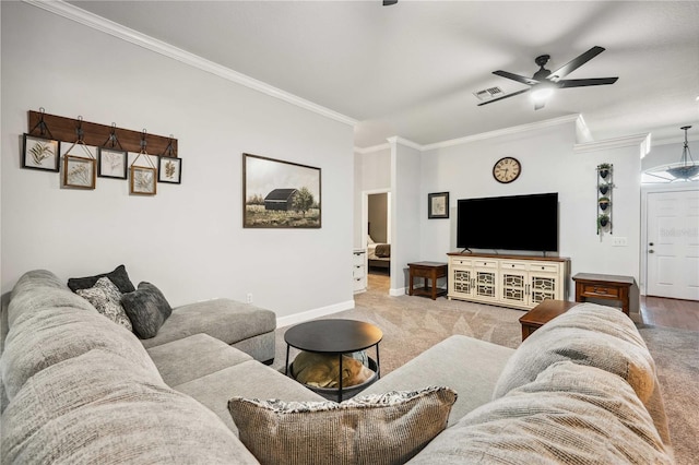 carpeted living room with visible vents, ceiling fan, crown molding, and baseboards