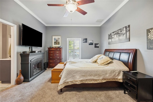 bedroom featuring light carpet, visible vents, ceiling fan, and ornamental molding