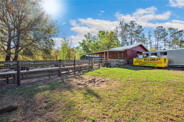 view of yard featuring an exterior structure and an outbuilding