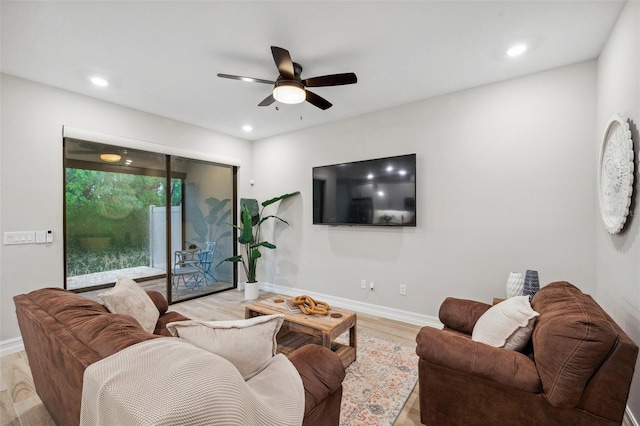 living area with recessed lighting, baseboards, light wood-type flooring, and ceiling fan