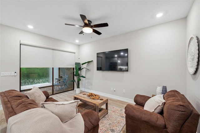 living room featuring recessed lighting, baseboards, wood finished floors, and a ceiling fan