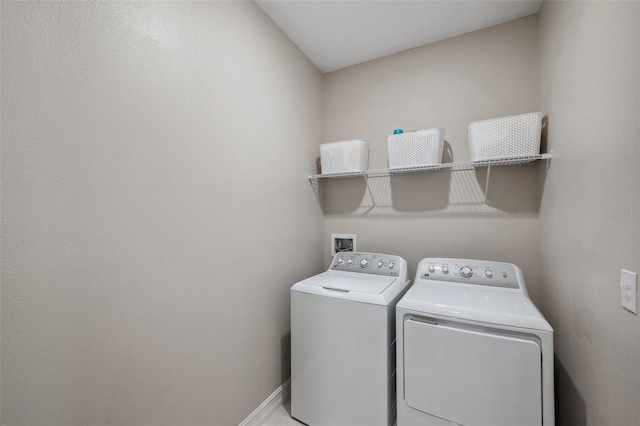 laundry room with laundry area and washer and clothes dryer