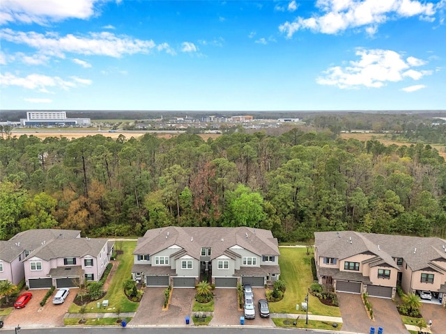 aerial view with a residential view and a view of trees