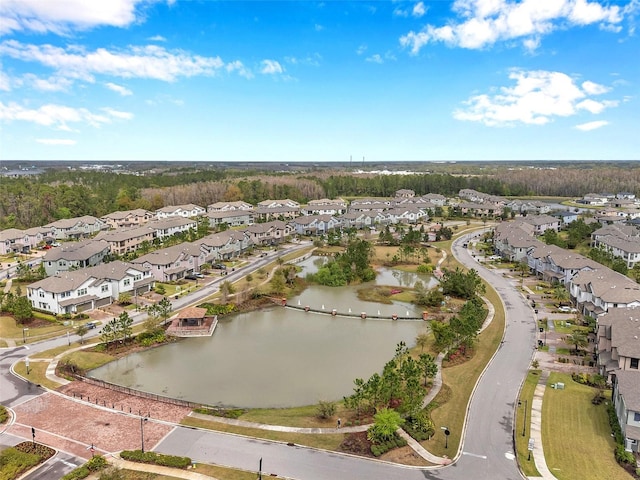 bird's eye view featuring a residential view and a water view