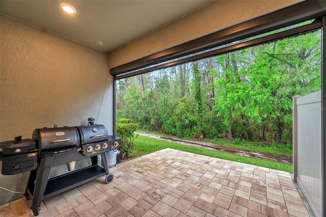 view of patio with a grill