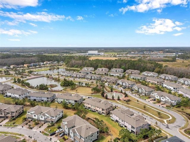 birds eye view of property with a residential view and a water view