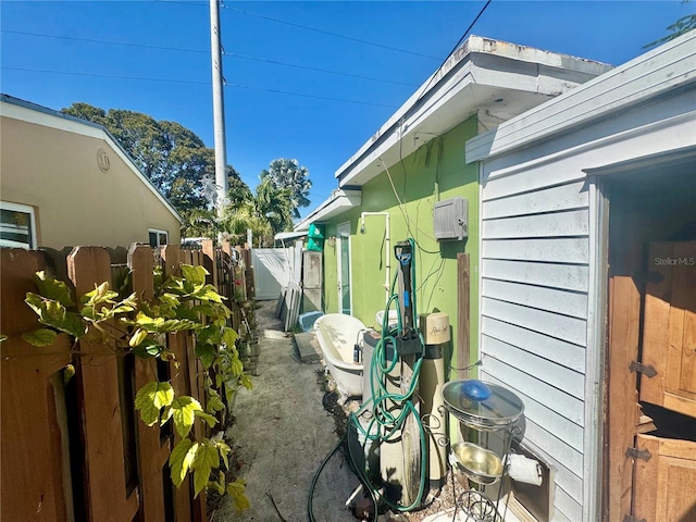 view of home's exterior with fence