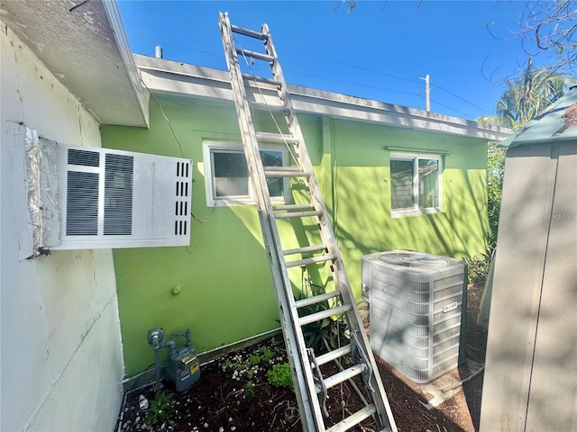 view of home's exterior featuring central AC unit and stucco siding