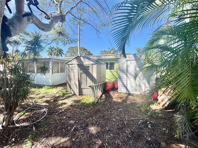 exterior space with a storage unit and an outdoor structure