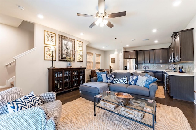 living room featuring dark wood-type flooring, recessed lighting, and ceiling fan