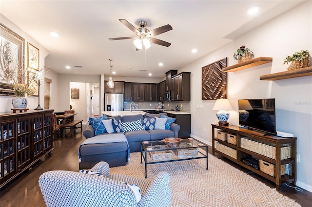 living area featuring dark wood finished floors, recessed lighting, baseboards, and a ceiling fan