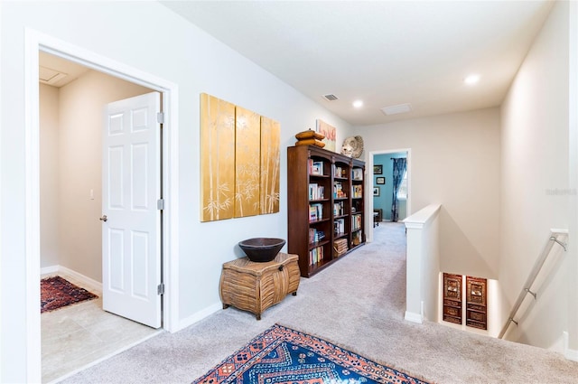 hall featuring visible vents, carpet floors, baseboards, recessed lighting, and an upstairs landing