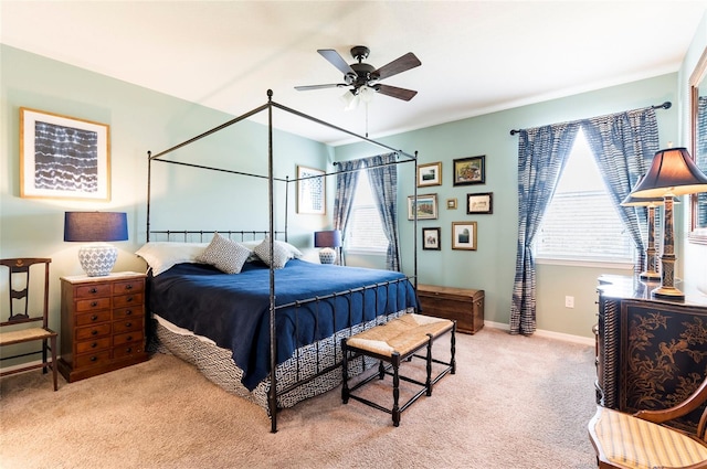 bedroom featuring ceiling fan, baseboards, and light carpet