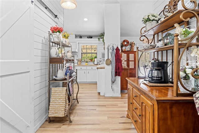 kitchen featuring white cabinetry and light wood-style floors